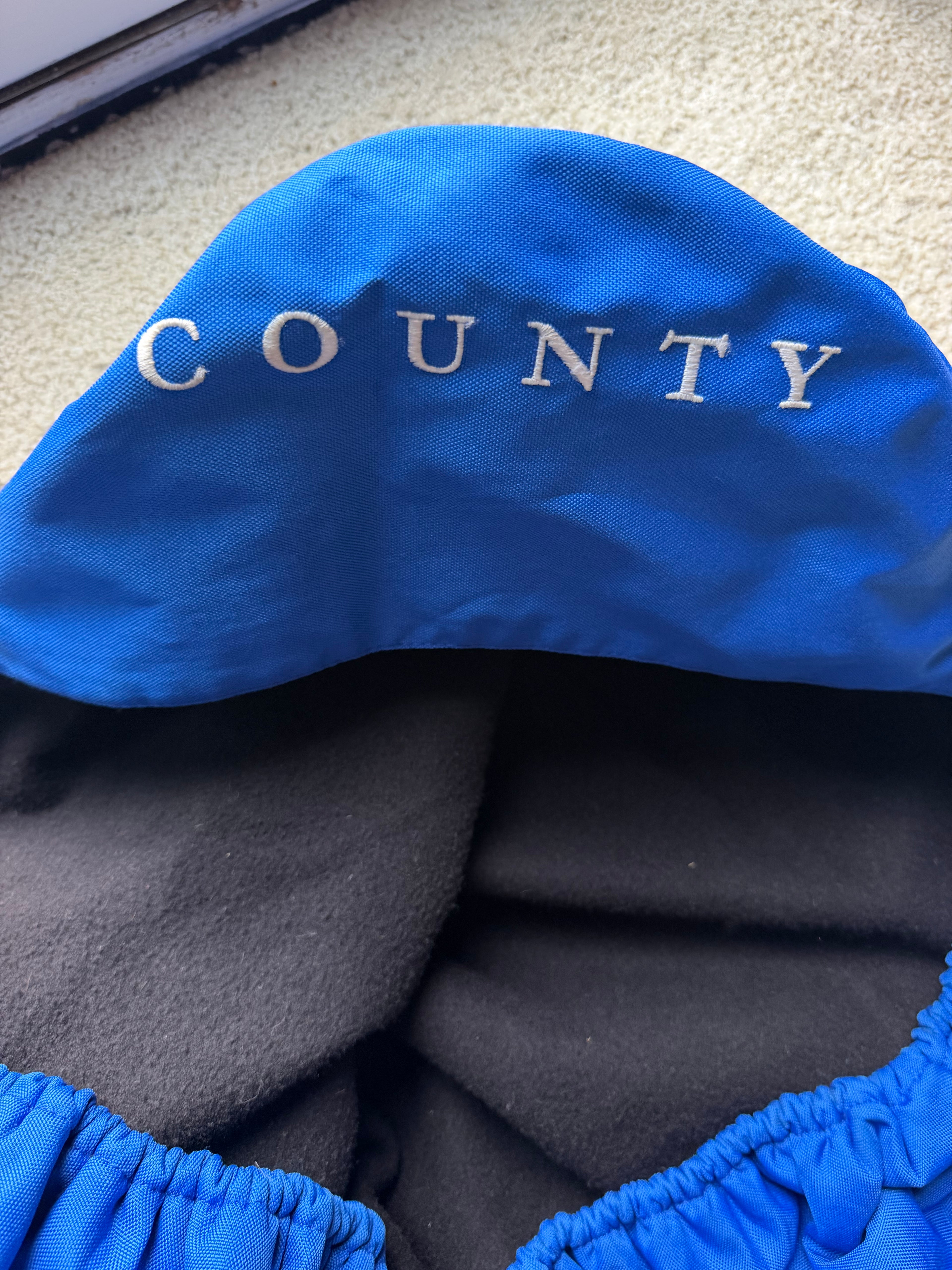 County Saddlery logo fleece lined cover